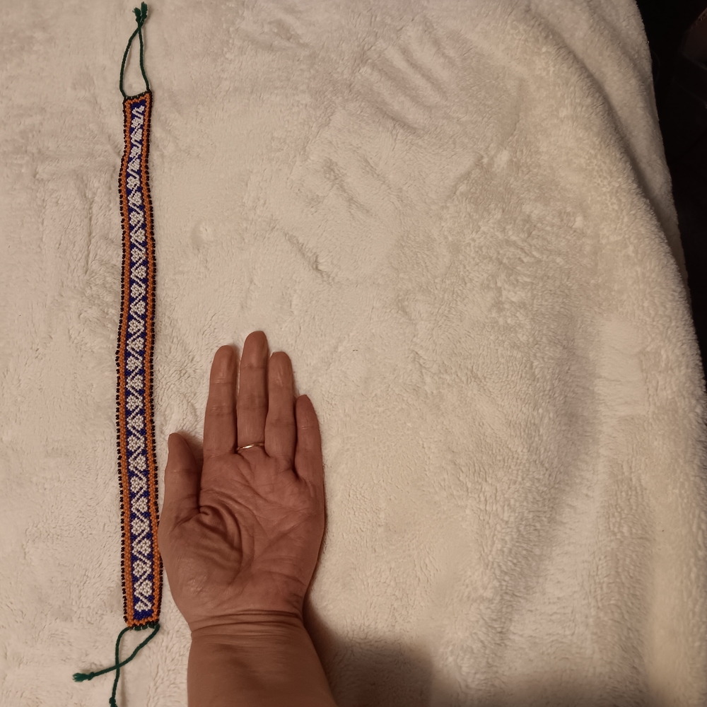 Handmade, Beaded  with Geometric Pattern.